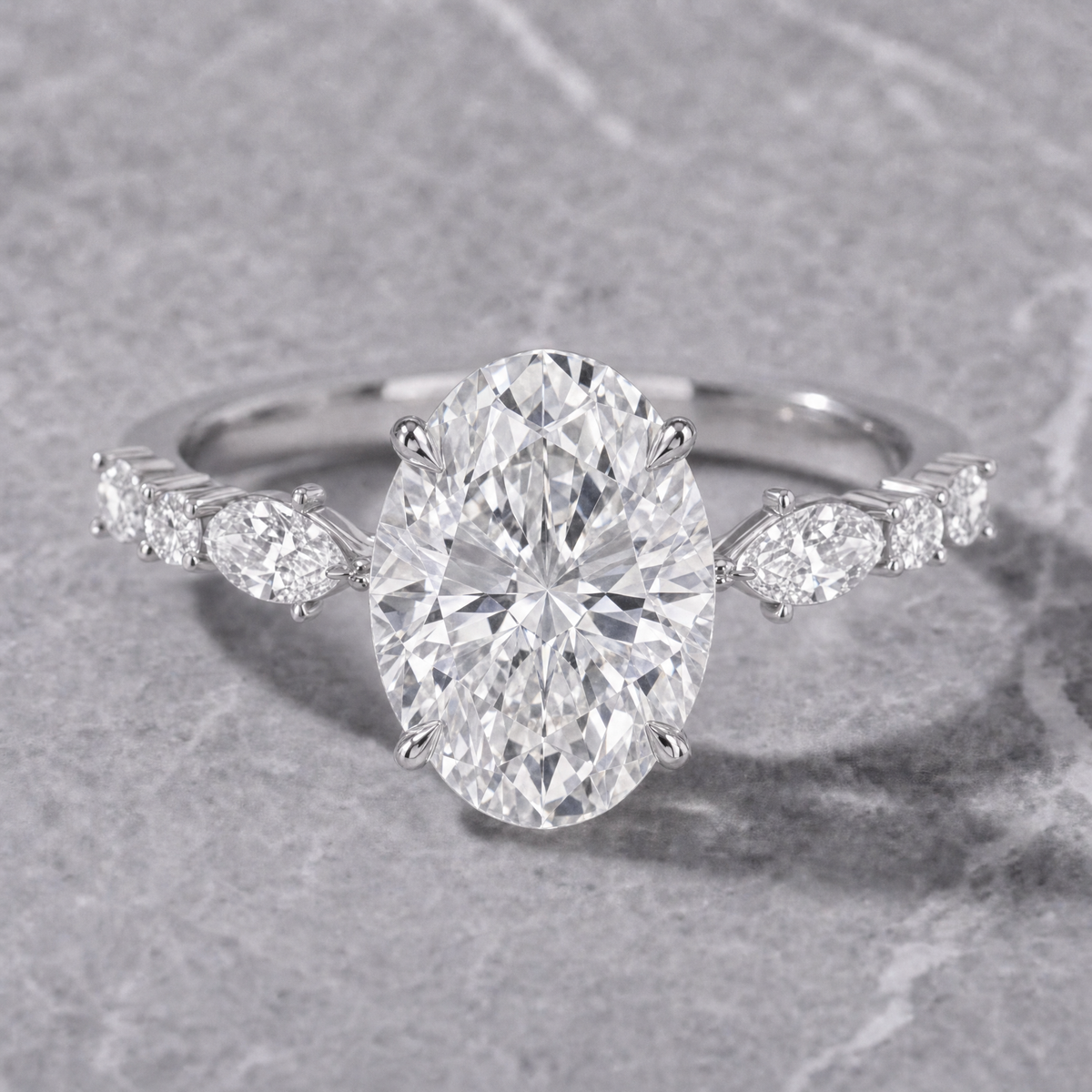 Elizabeth Oval Cut Diamond Engagement Ring With A Marquise And Round Cut Diamond Band.
