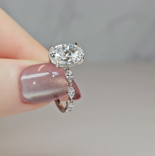 Kasandra Oval Cut Diamond Engagement Ring With A Marquise Cut Diamond Band