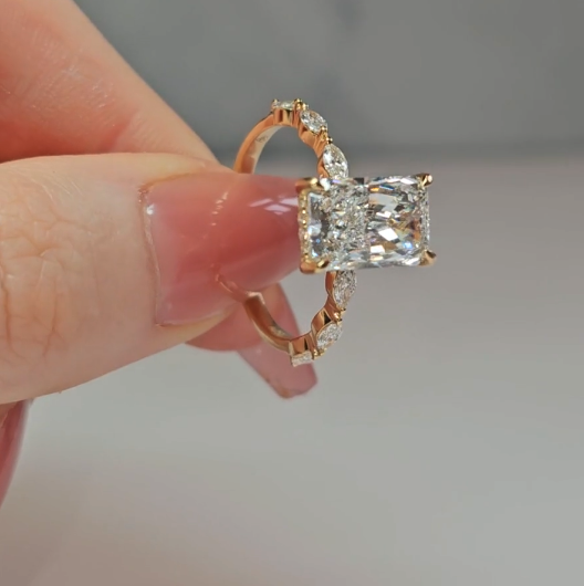 Kasandra Radiant Cut Diamond Engagement Ring With A Marquise Cut Diamond Band