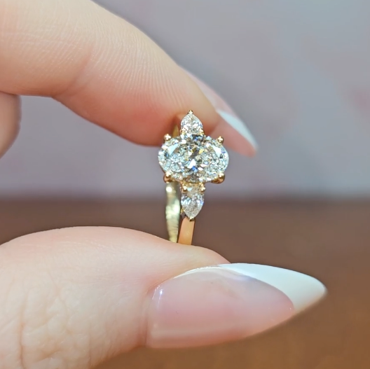 Sofia Oval Cut Diamond Engagement Ring With A Pear Cut Side Diamonds