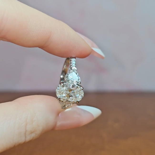 Victoria Oval Cut Diamond Engagement Ring with Heart Cut Side Diamonds and 3D Diamond Band