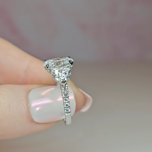 Victoria Oval Cut Diamond Engagement Ring with Heart Cut Side Diamonds and 3D Diamond Band