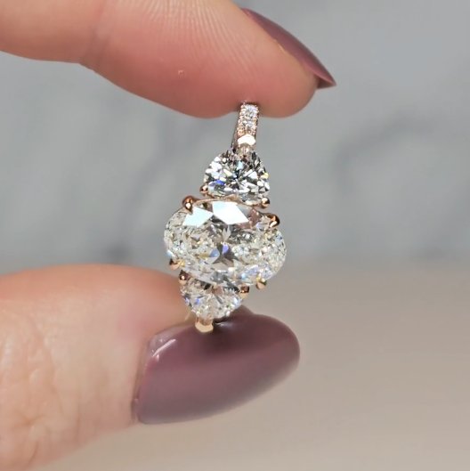 Victoria Oval Cut Diamond Engagement Ring with Heart Cut Side Diamonds and 3D Diamond Band