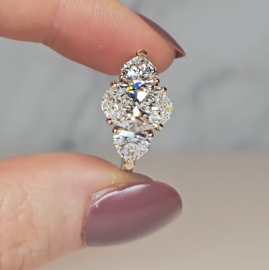 Victoria Oval Cut Diamond Engagement Ring with Heart Cut Side Diamonds and 3D Diamond Band