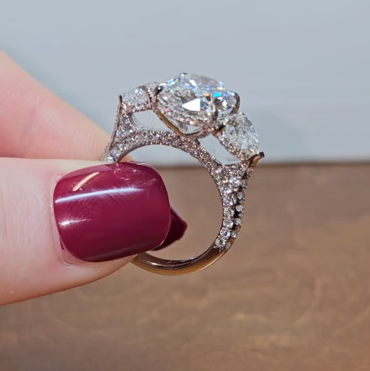 Victoria Oval Cut Diamond Engagement Ring with Heart Cut Side Diamonds and 3D Diamond Band