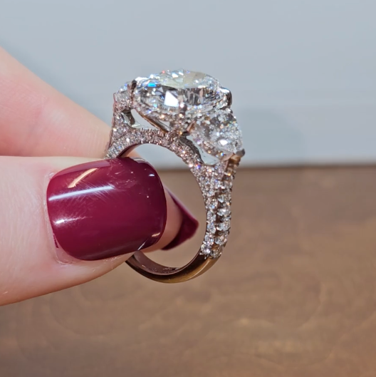 Victoria Oval Cut Diamond Engagement Ring with Heart Cut Side Diamonds and 3D Diamond Band