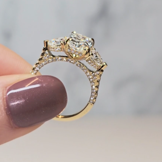 Victoria Radiant Cut Diamond Engagement Ring with Heart Cut Side Diamonds and 3D Diamond Band
