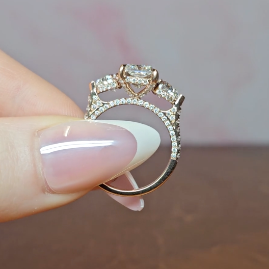 Victoria Radiant Cut Diamond Engagement Ring with Heart Cut Side Diamonds and 3D Diamond Band