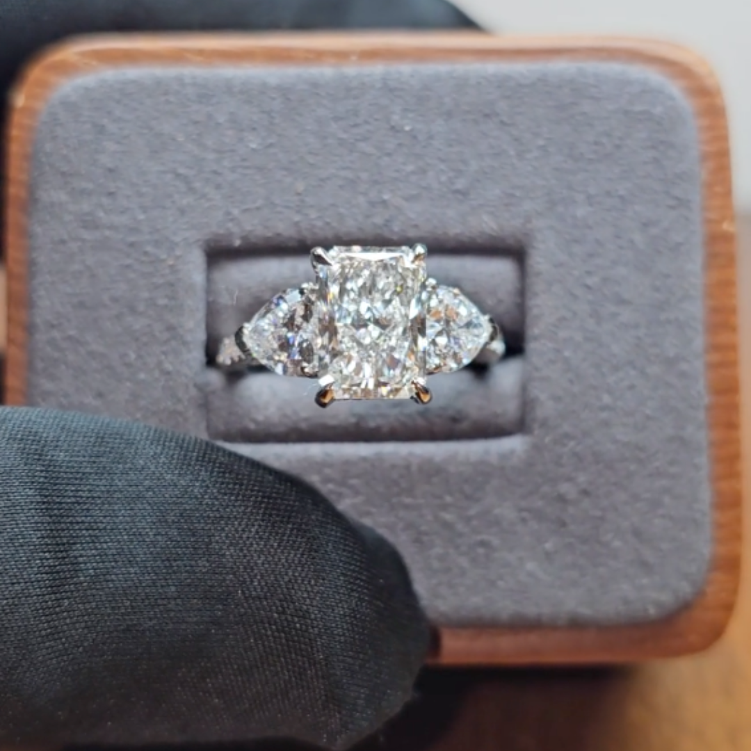 Victoria Radiant Cut Diamond Engagement Ring with Heart Cut Side Diamonds and 3D Diamond Band
