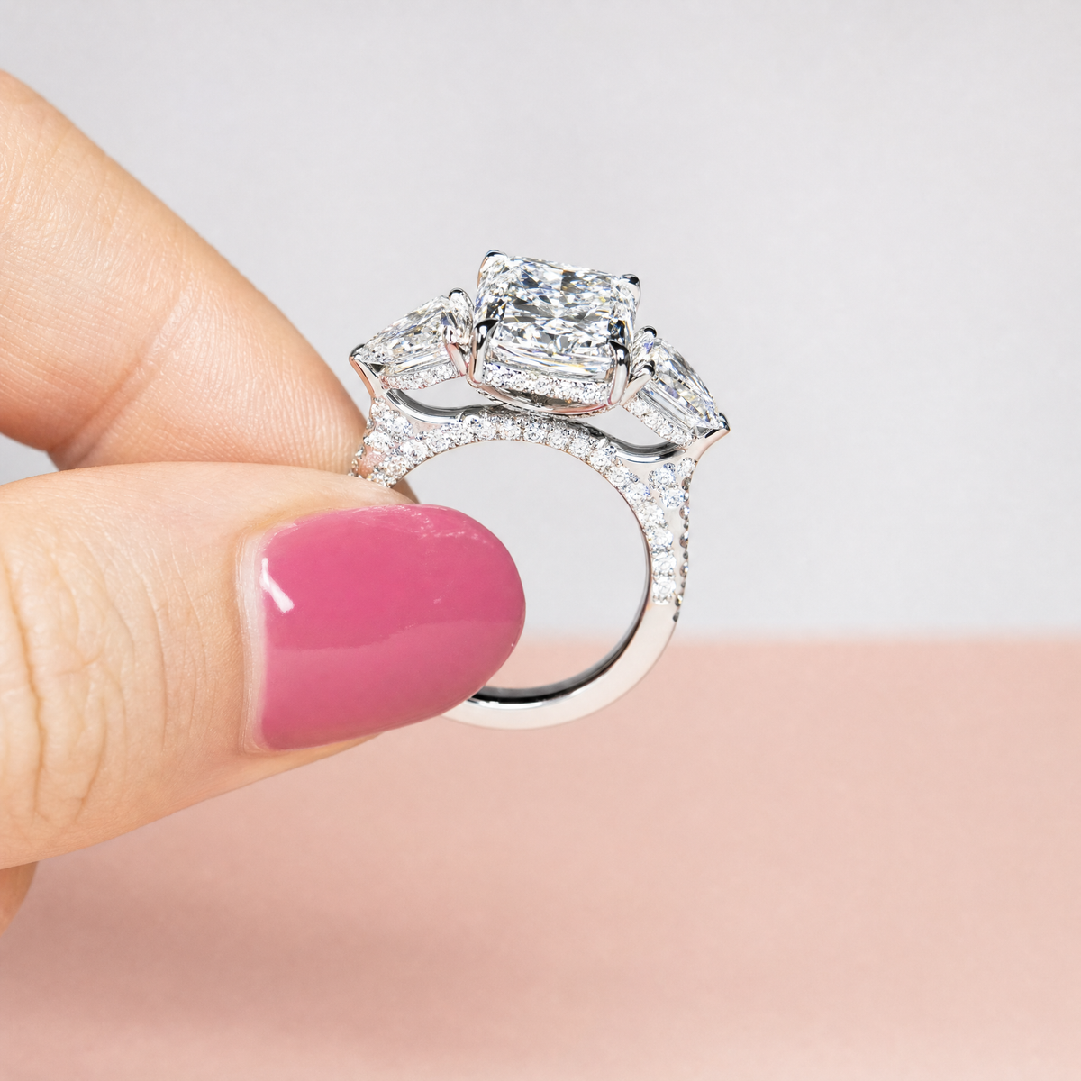 Victoria Radiant Cut Diamond Engagement Ring with Heart Cut Side Diamonds and 3D Diamond Band