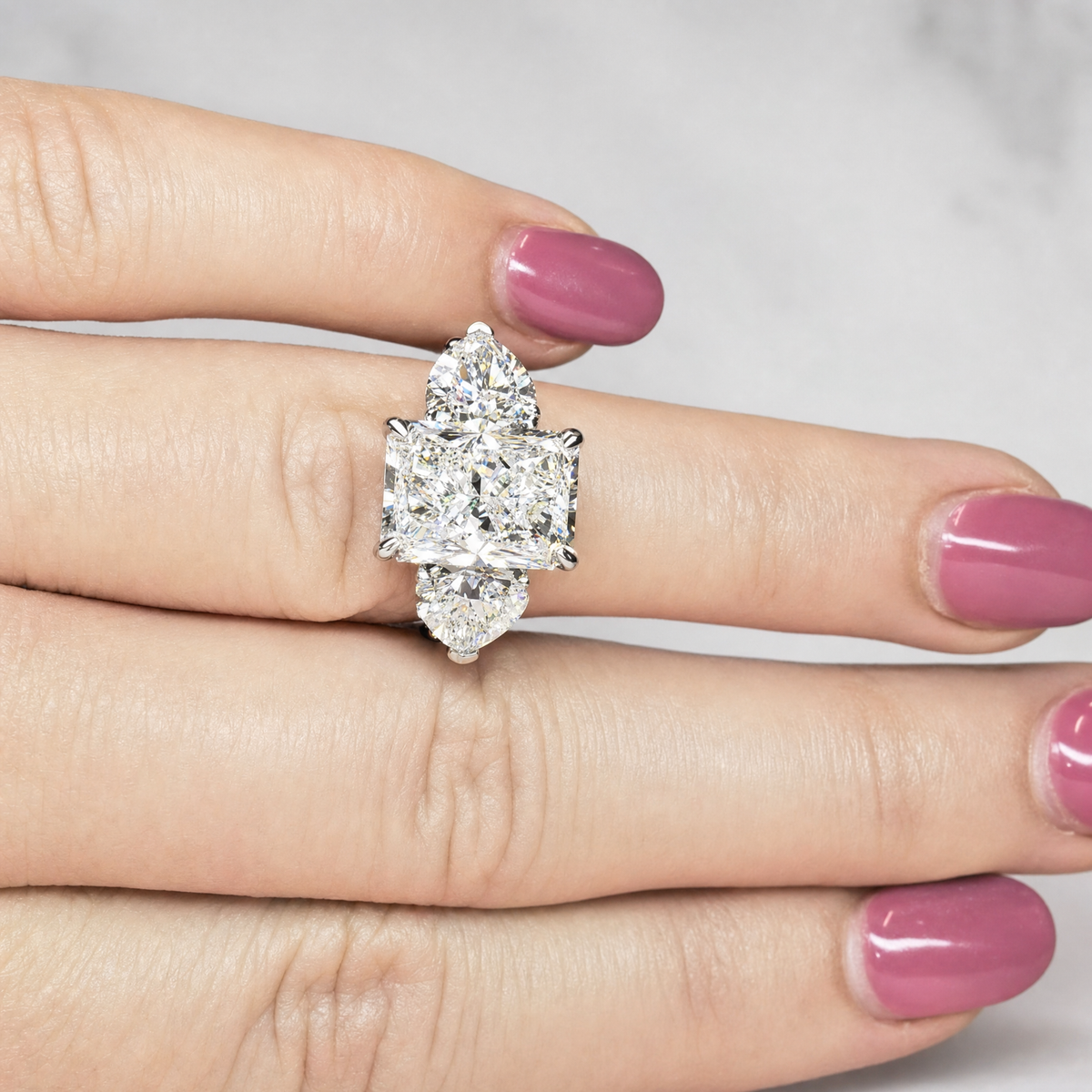 Victoria Radiant Cut Diamond Engagement Ring with Heart Cut Side Diamonds and 3D Diamond Band