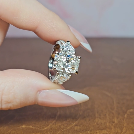 Victoria Radiant Cut Diamond Engagement Ring with Heart Cut Side Diamonds and 3D Diamond Band